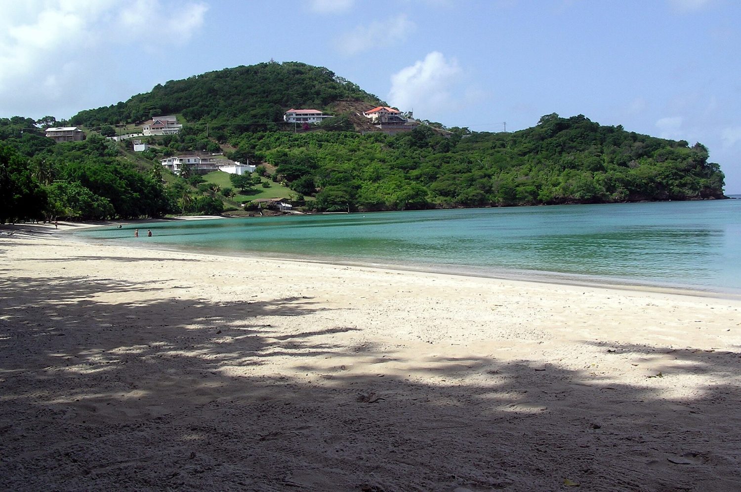 Morne Rouge Bay in Grenada during the day, with calm water and sand