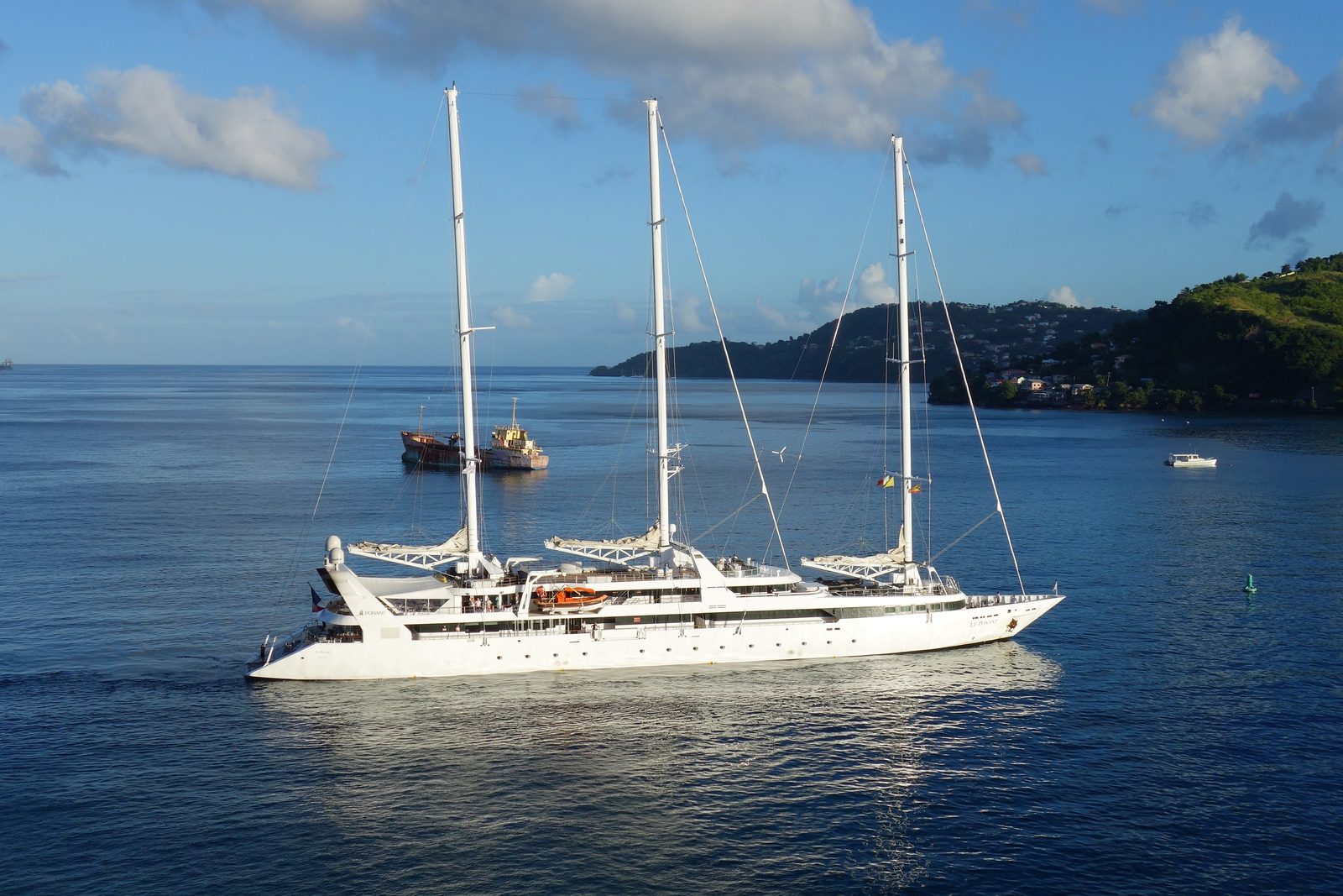 The three-masted sailing cruise ship Le Ponant arriving at Grenada in late afternoon light